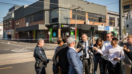 Detective Inspector Andrew Stamper addresses the media at the scene. 