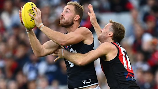 Harry McKay takes a telling mark against the Bombers.