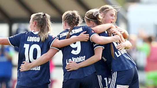 MELBOURNE, AUSTRALIA - JANUARY 10:  Amy Jackson of Melbourne Victory (R) celebrates her goal with team mates during the round three W-League match between Melbourne City and the Melbourne Victory at CB Smith Reserve, on January 10, 2021, in Melbourne, Australia. (Photo by Kelly Defina/Getty Images)