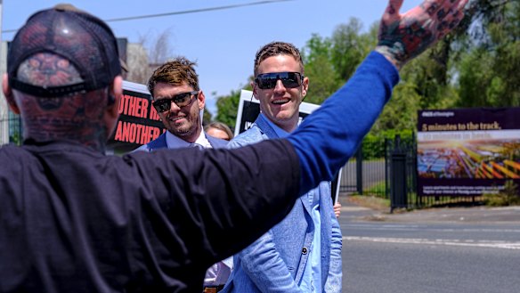 Protesters and racegoers interact before the Melbourne Cup.