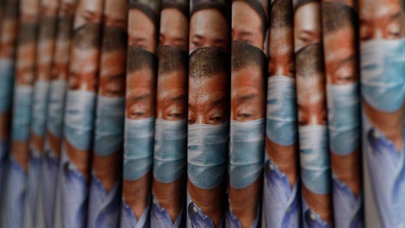 Copies of the Apple Daily newspaper with front pages featuring media tycoon Jimmy Lai are displayed for sale in Hong Kong. 