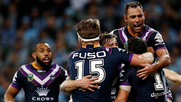 Storming home: Melbourne celebrate victory over the Sharks and another grand final appearance.