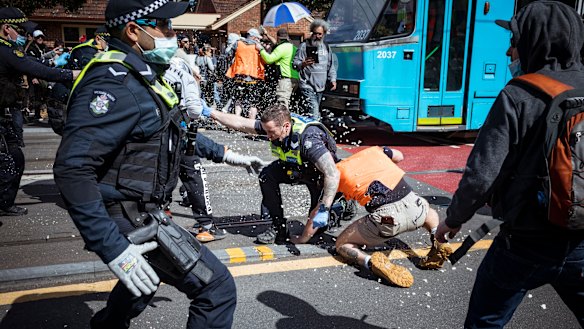 Protesters clashed with police during a violent anti-lockdown rally in Melbourne’s inner east on Saturday.