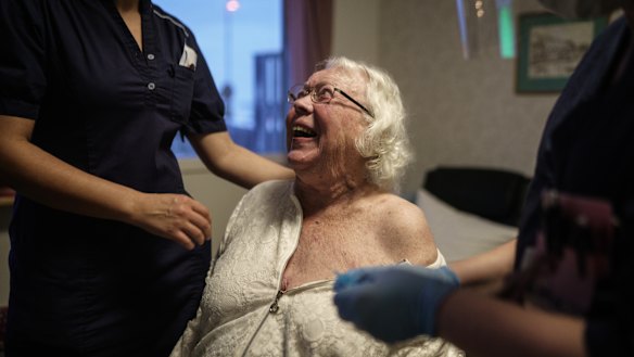 Auslag Westling, a resident at one of Attendo's nursing homes in Gothenburg receives her first dose of the Pfizer-BioNtech COVID-19 vaccine on Thursday. 