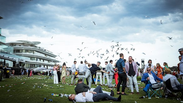 The seagulls begin to land at Flemington as Cup Day comes to an end.