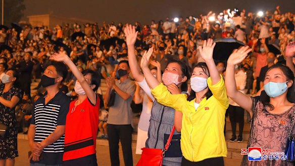 People wear face masks to help curb the spread of the coronavirus in Pyongyang, North Korea, on Monday.