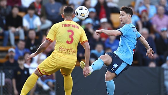 Alexander Baumjohann guides the ball over the Adelaide defence at Leichhardt Oval.