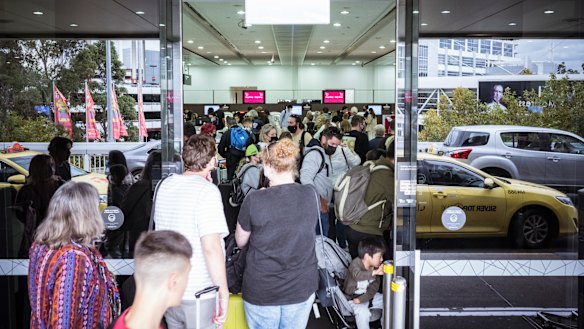 Large queues formed at Melbourne Airport’s terminal 3 departures on Tuesday.
