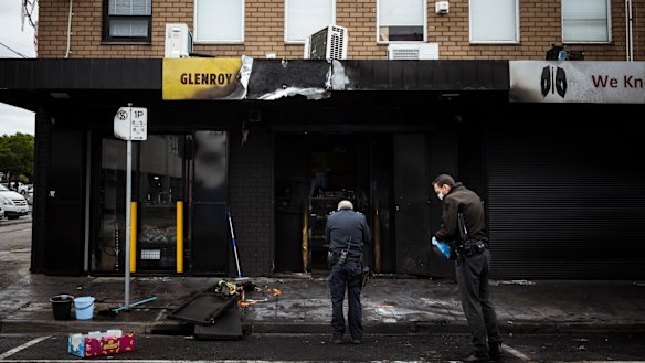 Police inspect the damage at Glenroy Convenience following an attack on March 29