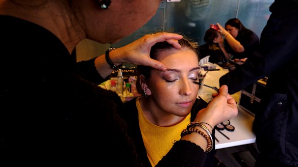 A model has their make-up applied backstage at Access to Fashion. 