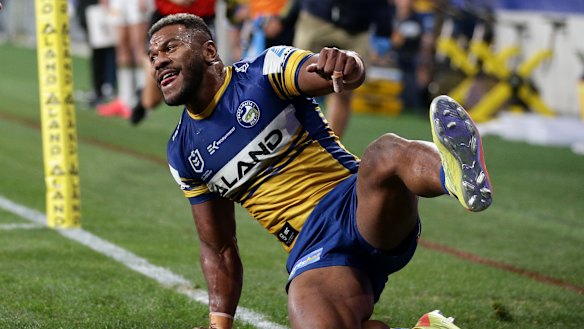 Maika Sivo scores one of his four tries against the Cowboys on Friday night.