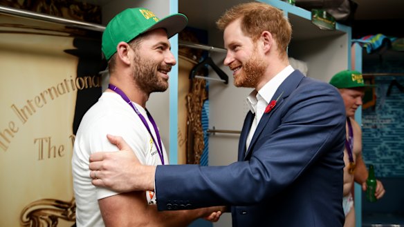 Spoils of victory: Springboks fullback Willie Le Roux meets Prince Harry in the winners' dressing room.