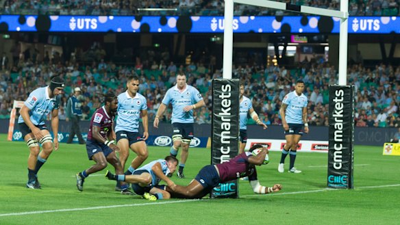 Slicing through: Samu Kerevi sets up an easy conversion as the Reds stage a fightback.