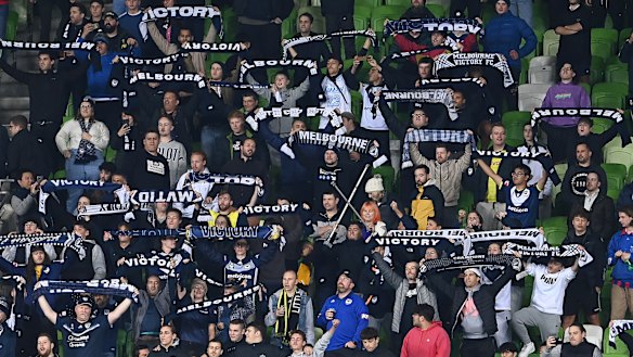 Melbourne Victory fans cheer on the Wellington Phoenix against Melbourne City.
