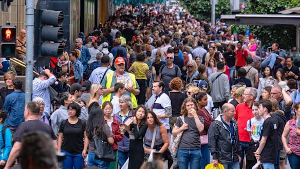 A very different picture: Shoppers pictured in Melbourne's CBD during last year's Christmas shopping rush.