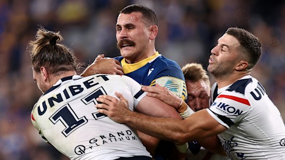 Reagan Campbell-Gillard is met by some strong Roosters defence.