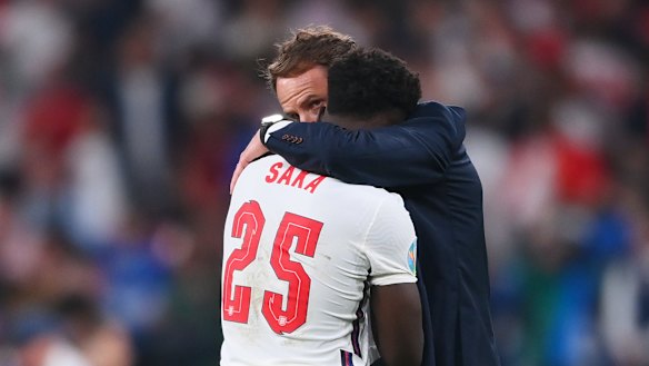 England manager Gareth Southgate consoles Bukayo Saka after the defeat to Italy.