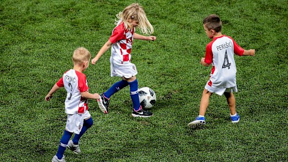 Children of the Croatian players celebrate victory at the end of the match against England 