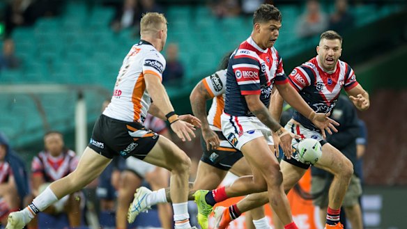 Deft: Mitchell kicks infield for Luke Keary with James Tedesco in pursuit at the SCG.