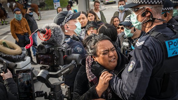 People were arrested at a small business anti-lockdown protest outside Flinders Street Station on Saturday.