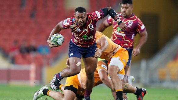 Hard to handle: Samu Kerevi makes a break for the Reds.