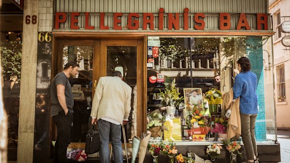 Mourners pay their respects to the co-owner of Pellegrini's, Sisto Malaspina,  after he was stabbed in the Bourke Street incident on Friday. 