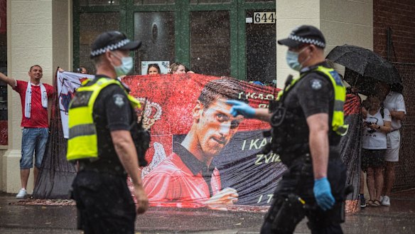 Novak Djokovic supporters protest   outside the Park Hotel where he is being held by Border Security, along with refugees in detention. 
