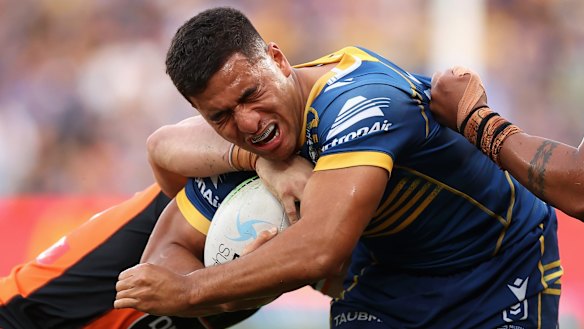 Eels centre Will Penisini takes on the Tigers defence.