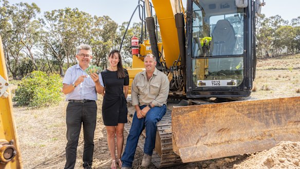 Royal Canberra Show chief executive Athol Chalmers launches the 'Dueling Excavators' competition with sponsors Yukari and Lee Carmody, of Drive This Canberra. The competition is part of a new-look main arena program at this year's Show.
