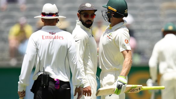 Virat Kohli and Tim Paine colliding during the 2018 Test series.
