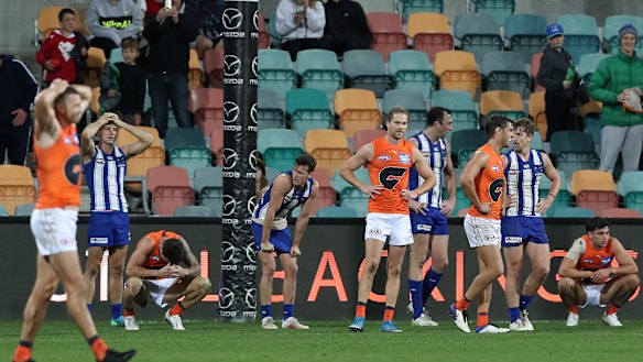 Players from both teams look dejected after the game ended in a draw.