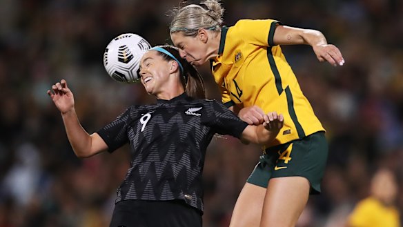 Australia’s Alanna Kennedy collides with Gabi Rennie.