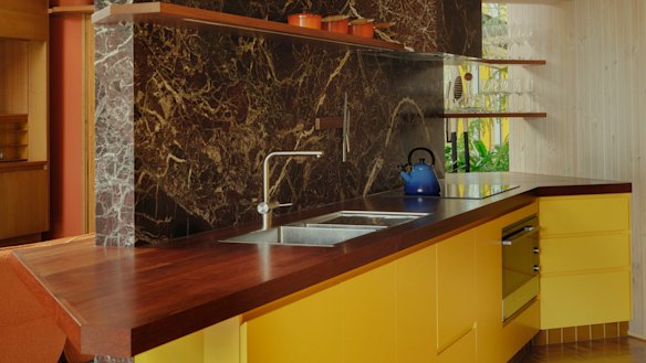 The kitchen’s joinery was replaced using two-pack yellow paint that was popular in the mid-1970s.