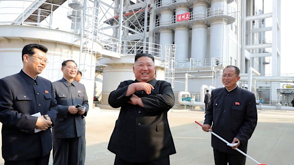 Kim Jong-un, centre, visits a fertiliser factory in South Pyongan, near Pyongyang, North Korea, on Friday.