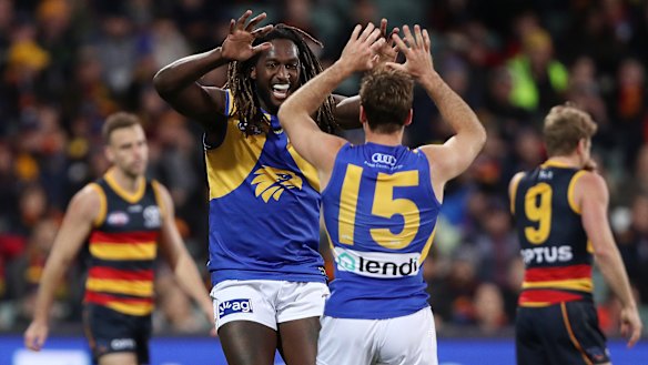 Jamie Cripps of the Eagles celebrates a goal with teammate Nic Naitanui.
