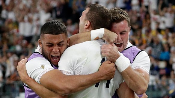 Killer blow: Jonny May, centre, celebrates his try that changed the match's momentum.