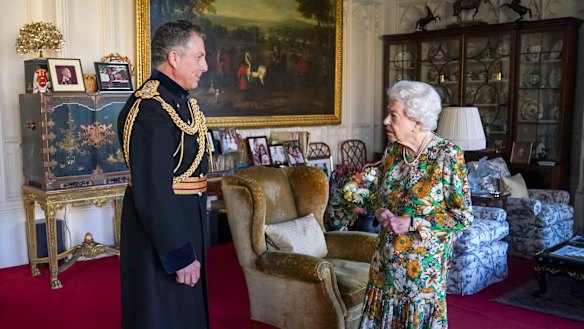 Queen Elizabeth II receives General Sir Nick Carter, Chief of the Defence Staff, left, during an audience in the Oak Room at Windsor Castle, Berkshire.