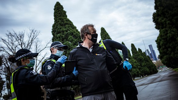 An anti-lockdown supporter is detained by Victoria Police after refusing to provide details and breaking the Chief Health Officer's guidelines.