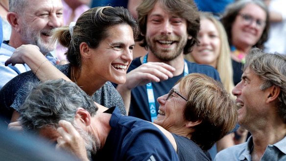 Amelie Mauresmo (left) enjoys Pouille's work at Melbourne Park.