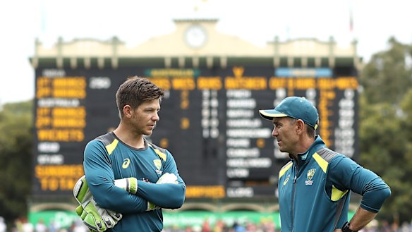 Tim Paine talking with Australia coach Justin Langer.