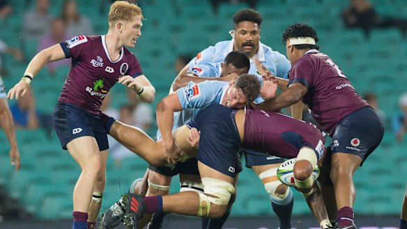 Crunch time: Lukhan Salakaia-Loto runs into some stern Waratahs defence.