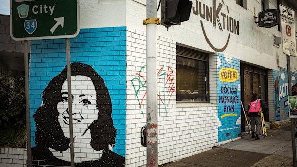 Painters pack up after being ordered to stop painting late on Friday afternoon.