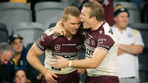Jake Trbojevic, right, hugs brother Tom after Manly’s win over Parramatta on Sunday.