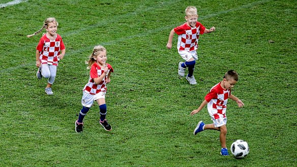 Youth development: Croatian players' children took to the field after their semi-final win.