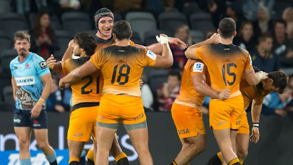 South American dreaming: The Jaguares celebrate victory over the Waratahs on Saturday.
