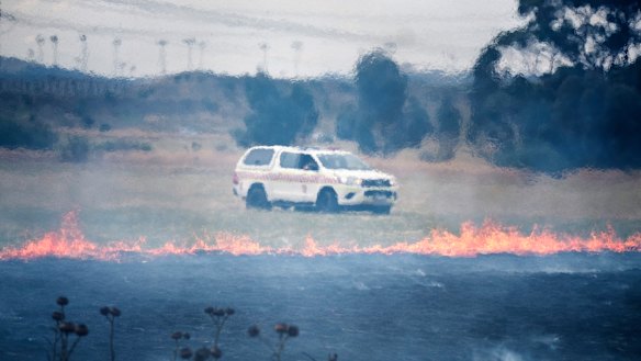 The grassfire burned at the side of the Calder Freeway on Monday.
