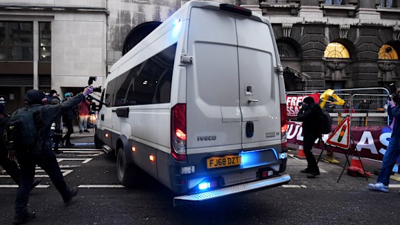 Police vans arrive at the Old Bailey in London ahead of WikiLeaks founder Julian Assange's hearing.
