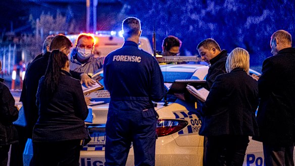 Forensic police at the scene of the stabbing in Kings Park on Saturday in which one boy was killed.