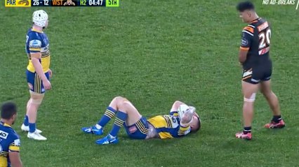 Nathan Brown lies on the ground during Parramatta's clash with the Wests Tigers.