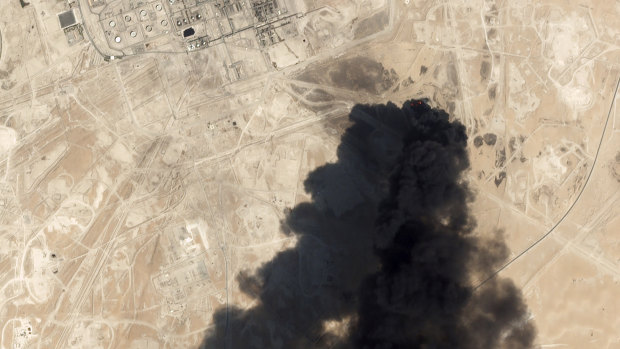 A satellite image shows thick black smoke rising from Saudi Aramco's Abqaiq oil processing facility. Riyadh reports that fires have now been extinguished.